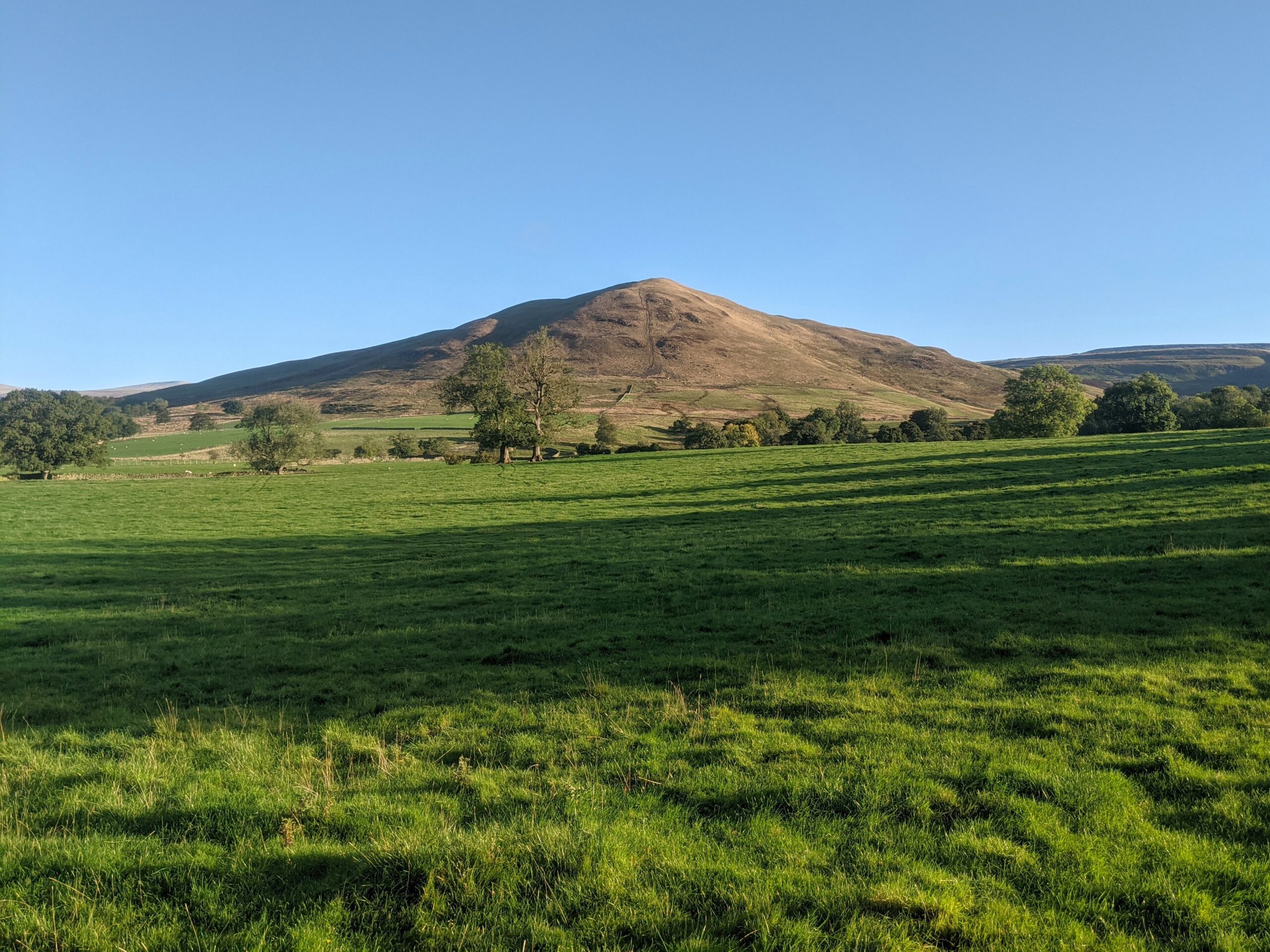 The green hills on a cold, clear morning