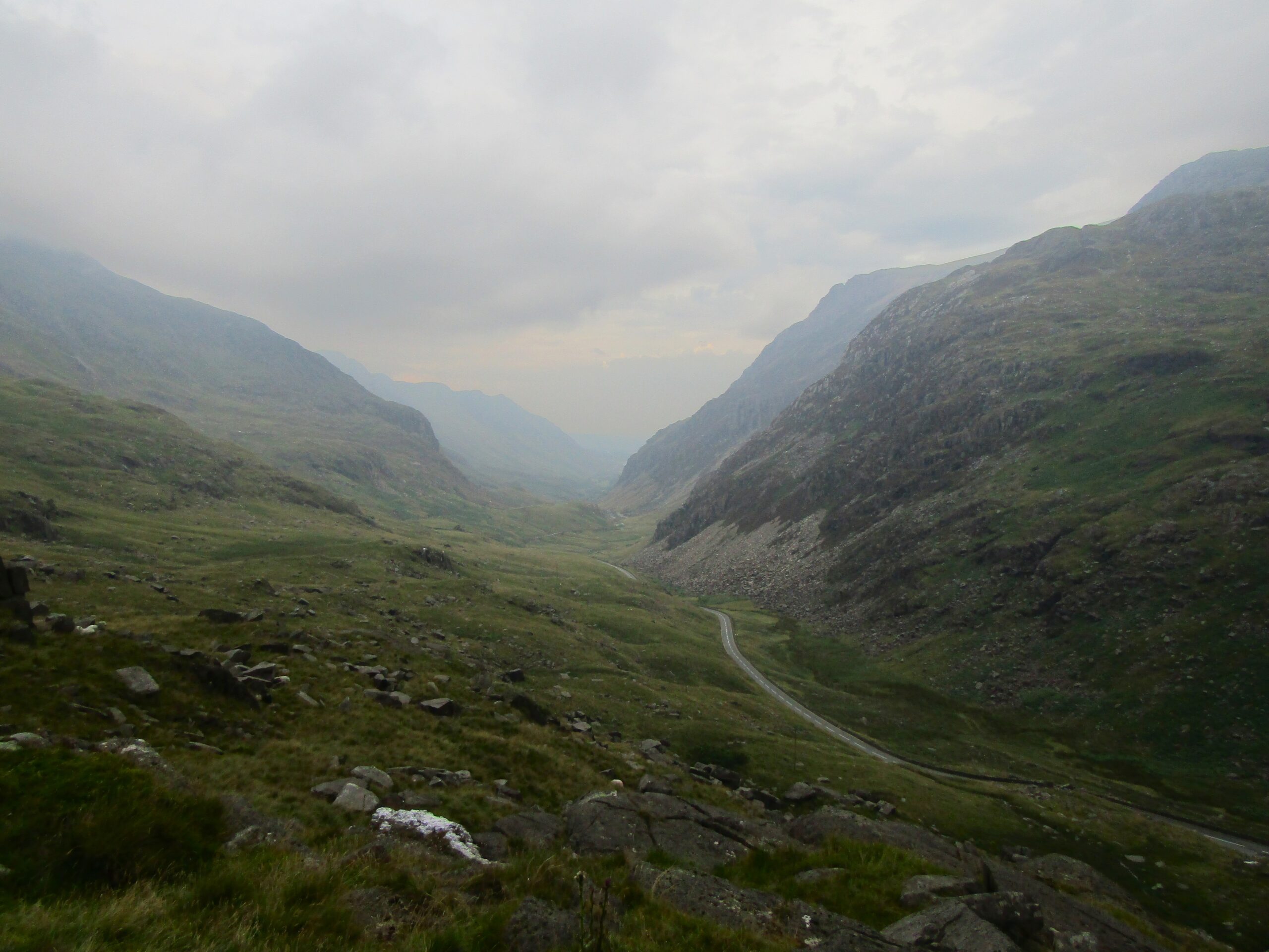 The road cuts through the valley